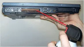 using-compressed-air-to-clean-fan-on-laptop