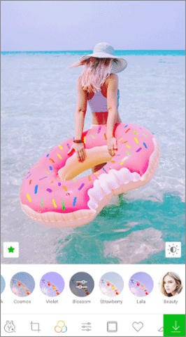 girl in sea with doughnut floater