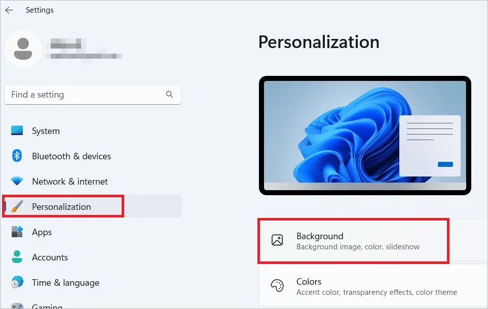 Select Personalization > Background to set different wallpapers on dual monitors